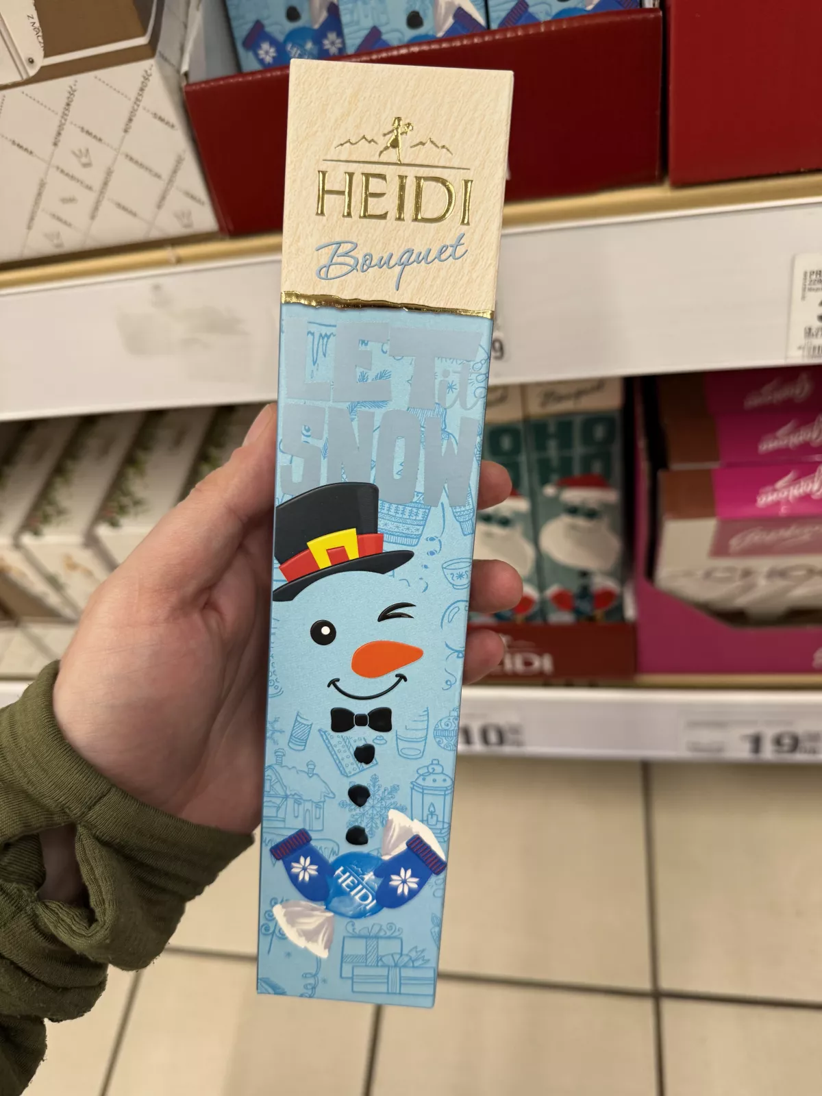 Heidi Bouquet Let it Snow / Praliny w czekoladzie mlecznej z nadzieniem o smaku kokosu | 70g
